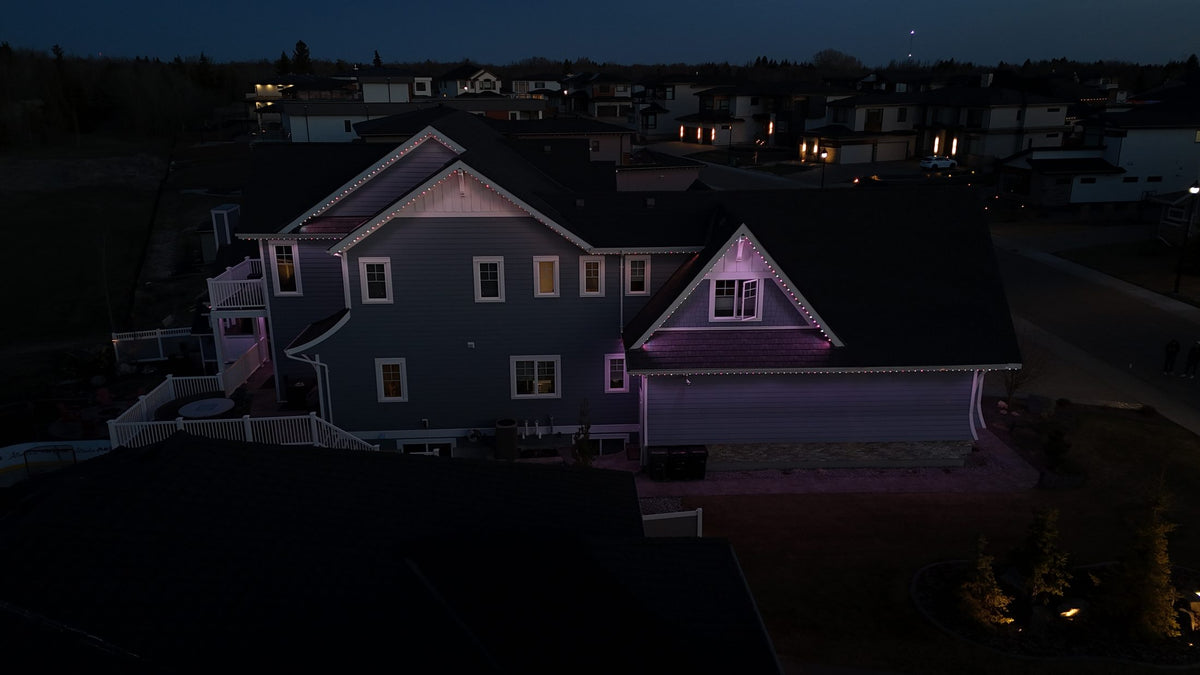 Home at dusk with roofline lighting hidden in the trim