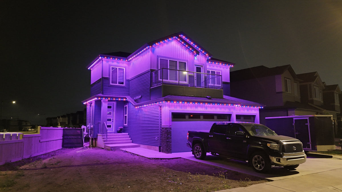 Home lit purple and blue with Horizon permanent roofline lights