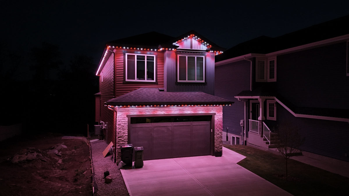 Home with Horizon permanent lights in red and white at night